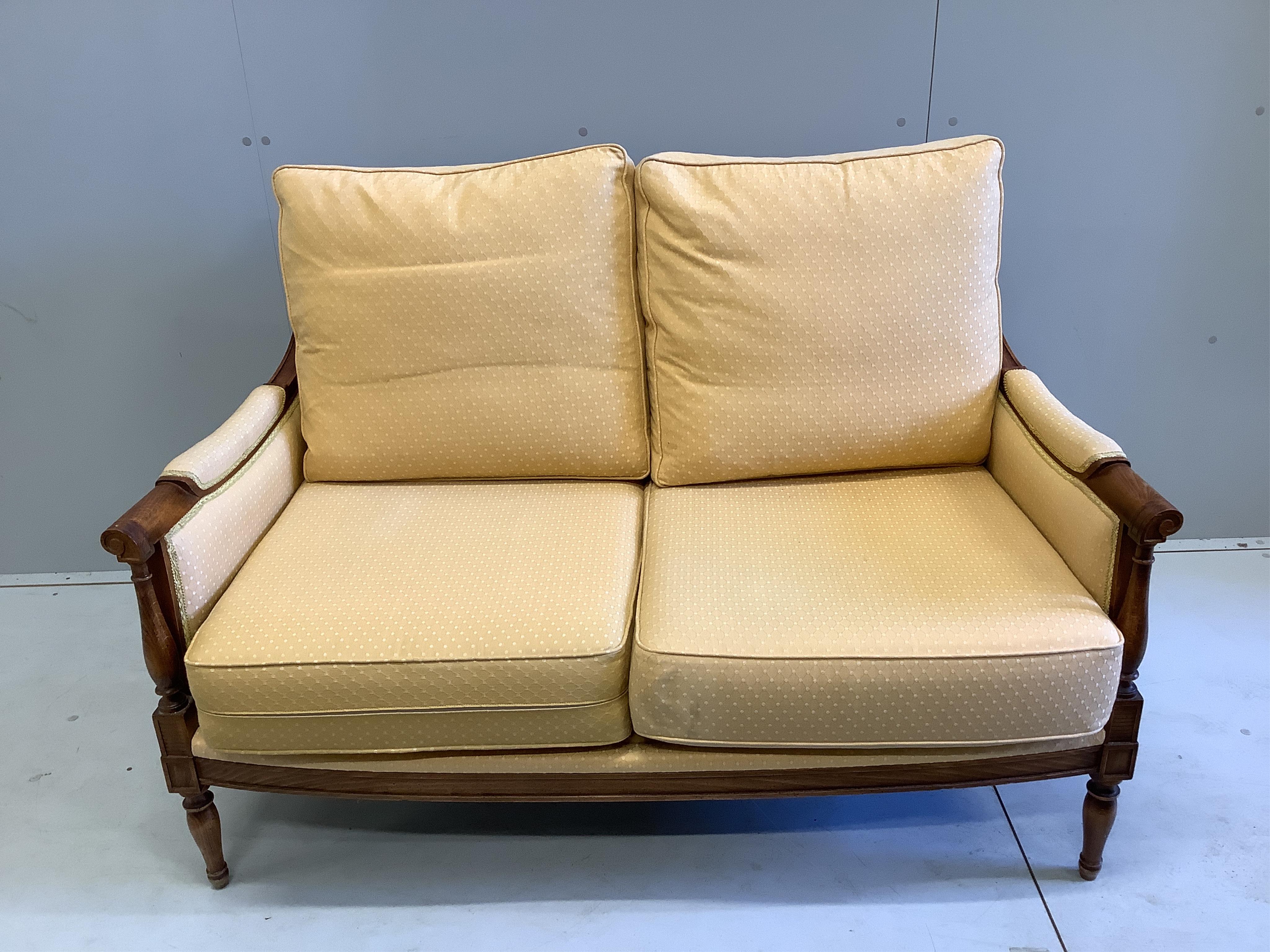 A Wesley-Barrell upholstered beech two seater settee, width 130cm, depth 75cm, height 85cm